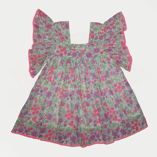 Floral dress with ruffled sleeves on a light gray background